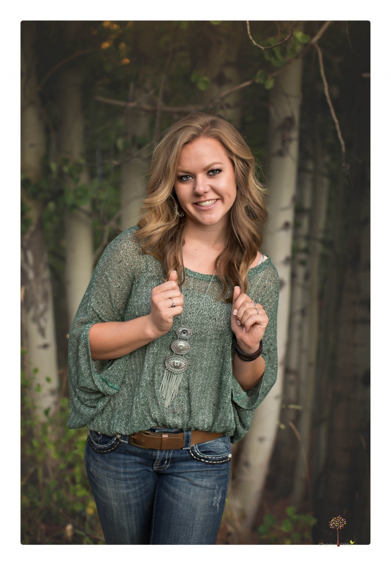 Summerville High senior portrait photographer Christine Dibble Photography of Sonora takes senior portraits of a girl in a field of wildflowers with her violin.
