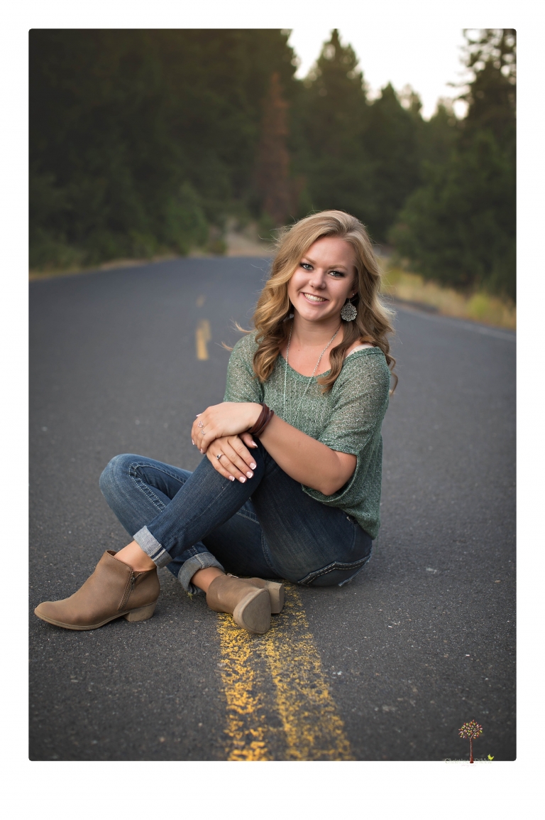 Summerville High senior portrait photographer Christine Dibble Photography of Sonora takes senior portraits of a girl in a field of wildflowers with her violin.
