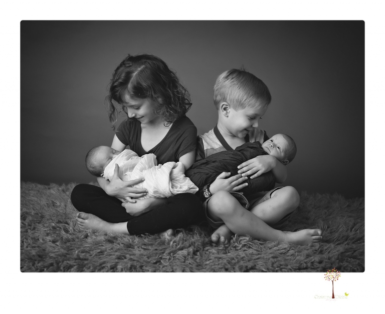 Best Sonora newborn photographer Christine Dibble Photography photographs newborn twins in a newborn portrait session in the studio with both babies posing alone and together.