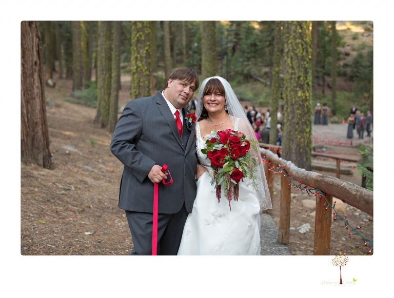 Sonora wedding photographer Christine Dibble Photography takes photos of a weekend wedding at the Pinecrest Chalet where the bride wore a red wedding dress.