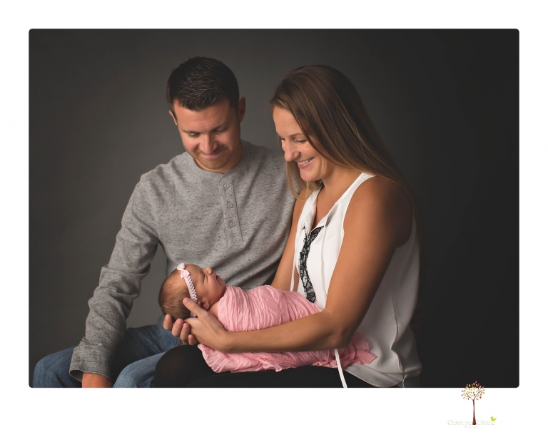 Best Sonora newborn photographer Christine Dibble Photography takes wide awake newborn studio portraits of a baby girl with her parents and in wraps.