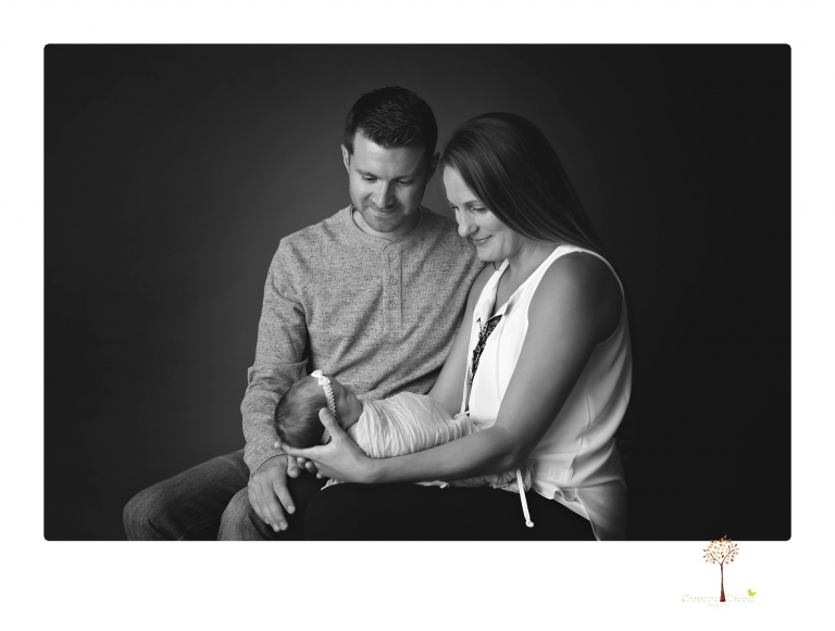 Best Sonora newborn photographer Christine Dibble Photography takes wide awake newborn studio portraits of a baby girl with her parents and in wraps.