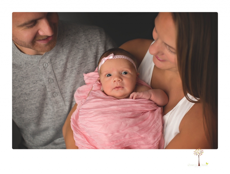 Best Sonora newborn photographer Christine Dibble Photography takes wide awake newborn studio portraits of a baby girl with her parents and in wraps.