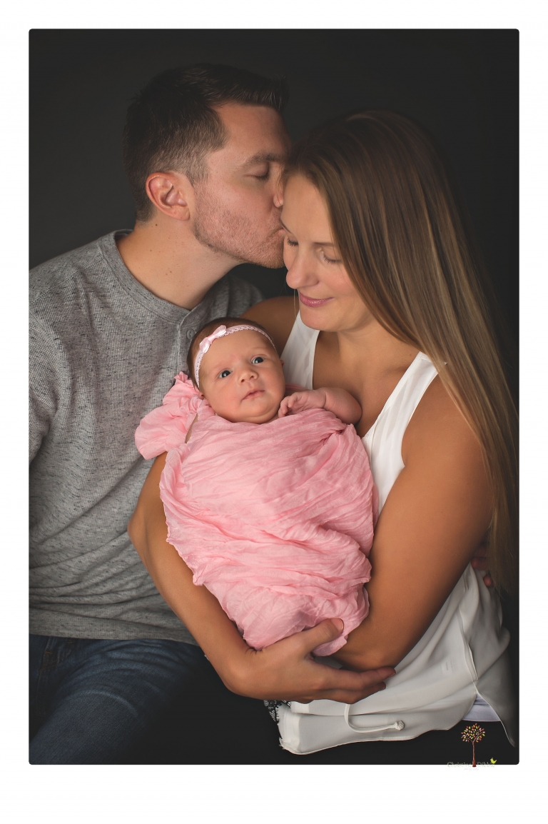 Best Sonora newborn photographer Christine Dibble Photography takes wide awake newborn studio portraits of a baby girl with her parents and in wraps.