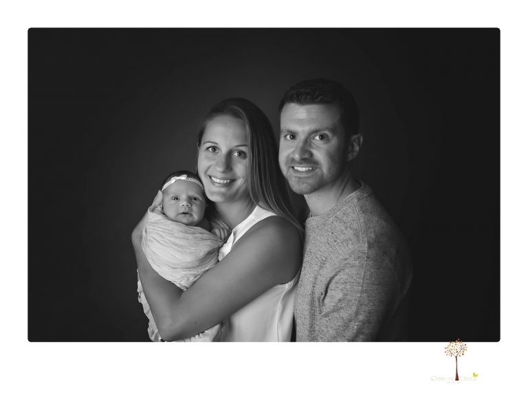 Best Sonora newborn photographer Christine Dibble Photography takes wide awake newborn studio portraits of a baby girl with her parents and in wraps.