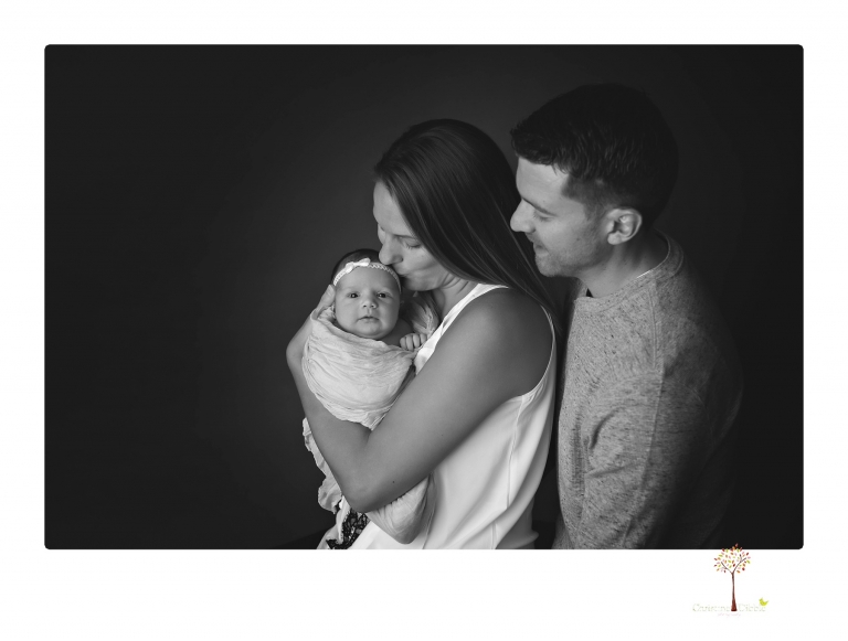 Best Sonora newborn photographer Christine Dibble Photography takes wide awake newborn studio portraits of a baby girl with her parents and in wraps.