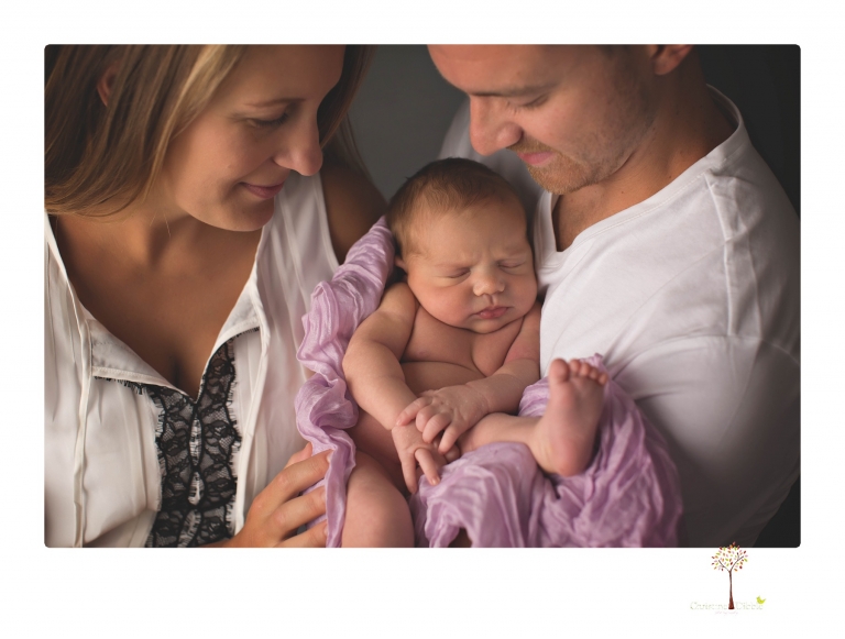 Best Sonora newborn photographer Christine Dibble Photography takes wide awake newborn studio portraits of a baby girl with her parents and in wraps.