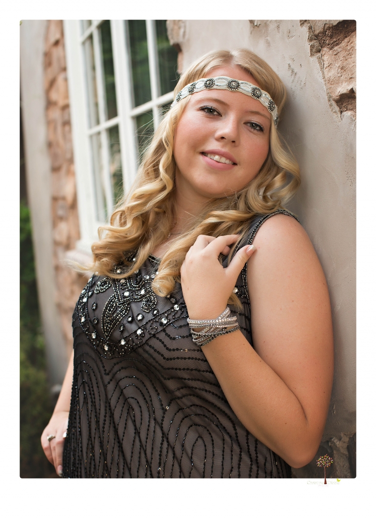 Sonora senior photographer Christine Dibble Photography takes portraits of two cousins dressed as flappers in Copperopolis Town Square before one leaves for college.