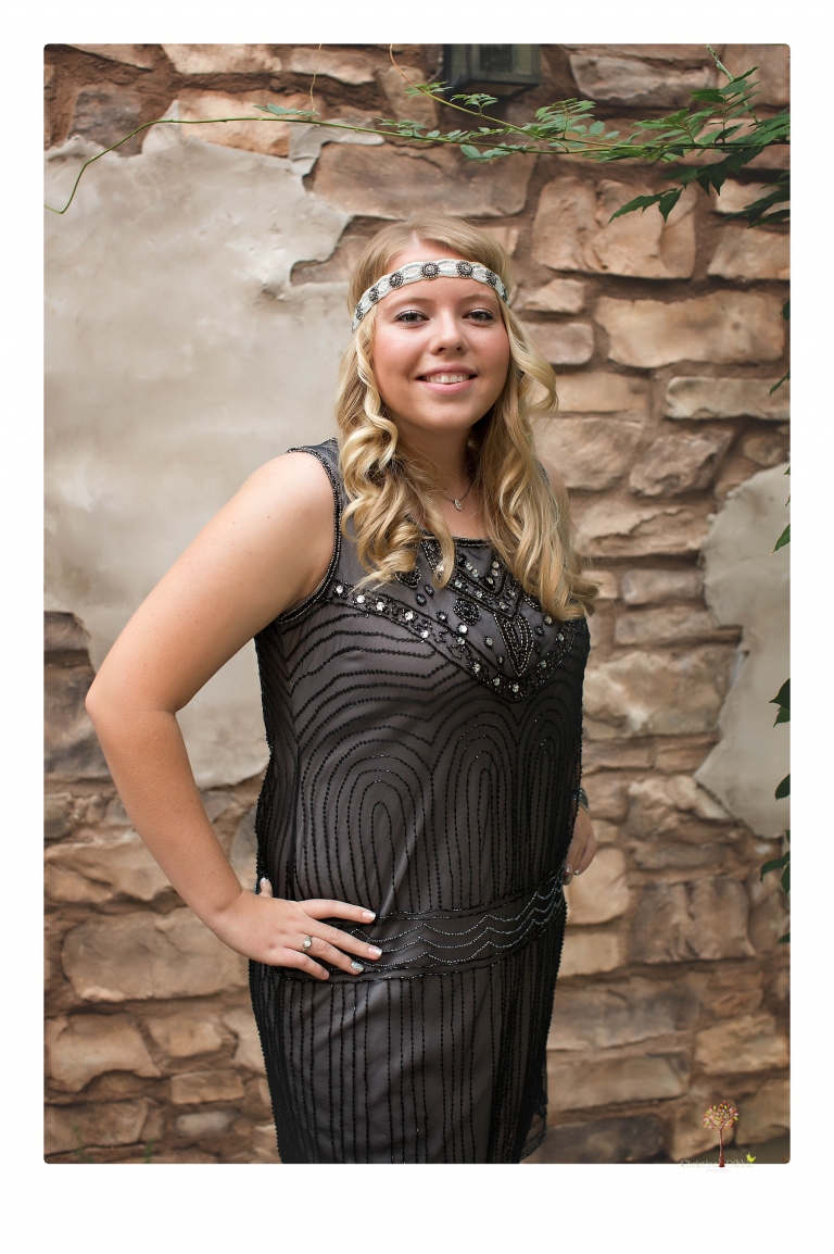 Sonora senior photographer Christine Dibble Photography takes portraits of two cousins dressed as flappers in Copperopolis Town Square before one leaves for college.