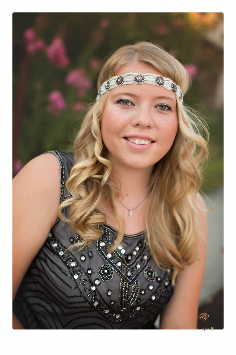 Sonora senior photographer Christine Dibble Photography takes portraits of two cousins dressed as flappers in Copperopolis Town Square before one leaves for college.