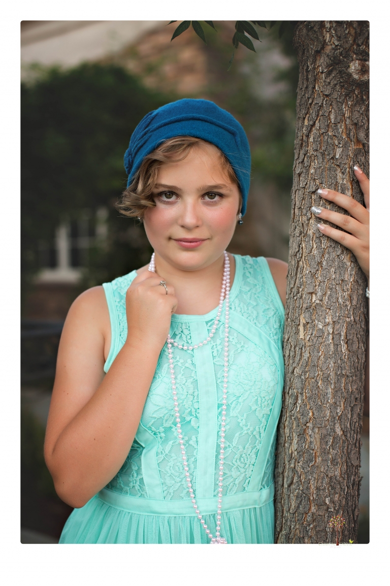Sonora senior photographer Christine Dibble Photography takes portraits of two cousins dressed as flappers in Copperopolis Town Square before one leaves for college.