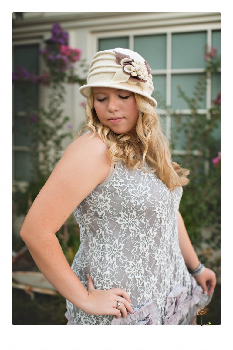 Sonora senior photographer Christine Dibble Photography takes portraits of two cousins dressed as flappers in Copperopolis Town Square before one leaves for college.