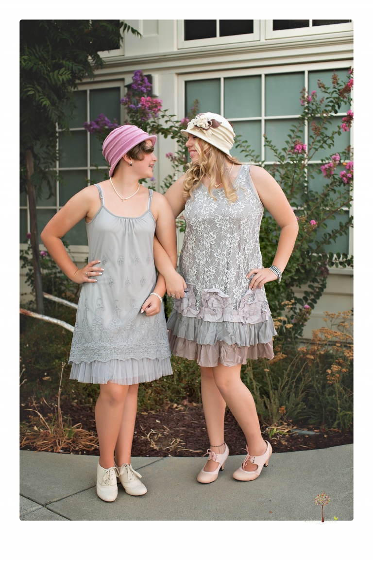 Sonora senior photographer Christine Dibble Photography takes portraits of two cousins dressed as flappers in Copperopolis Town Square before one leaves for college.
