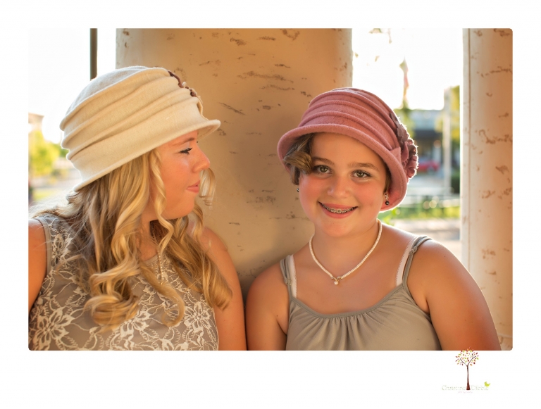 Sonora senior photographer Christine Dibble Photography takes portraits of two cousins dressed as flappers in Copperopolis Town Square before one leaves for college.