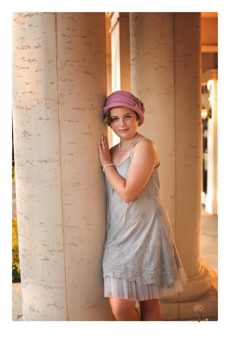Sonora senior photographer Christine Dibble Photography takes portraits of two cousins dressed as flappers in Copperopolis Town Square before one leaves for college.