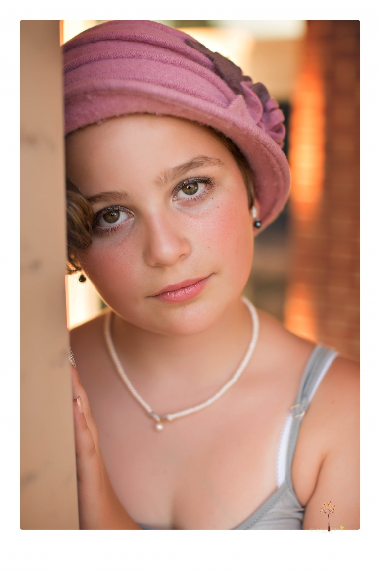 Sonora senior photographer Christine Dibble Photography takes portraits of two cousins dressed as flappers in Copperopolis Town Square before one leaves for college.