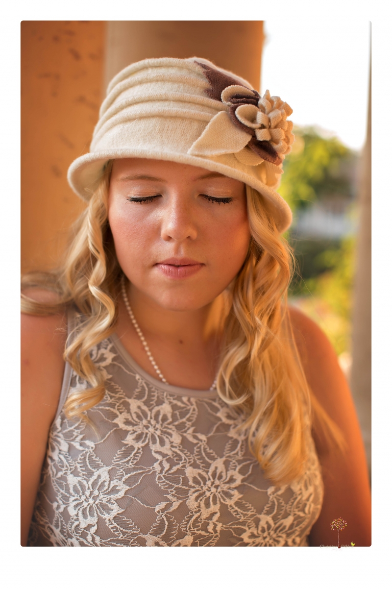 Sonora senior photographer Christine Dibble Photography takes portraits of two cousins dressed as flappers in Copperopolis Town Square before one leaves for college.