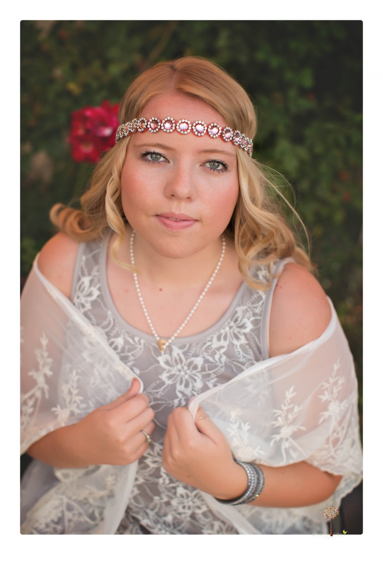 Sonora senior photographer Christine Dibble Photography takes portraits of two cousins dressed as flappers in Copperopolis Town Square before one leaves for college.