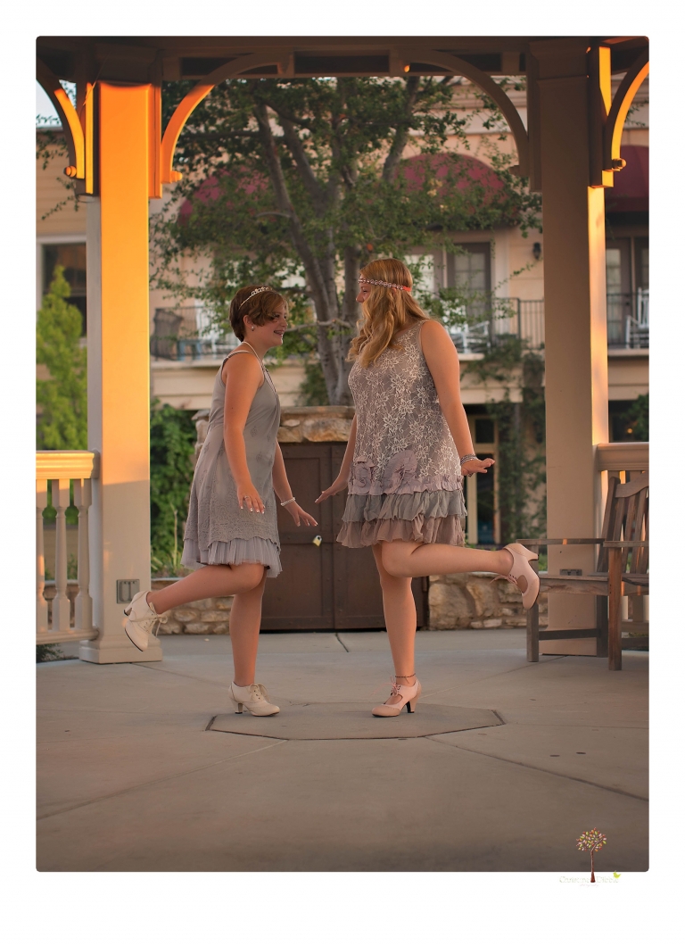 Sonora senior photographer Christine Dibble Photography takes portraits of two cousins dressed as flappers in Copperopolis Town Square before one leaves for college.