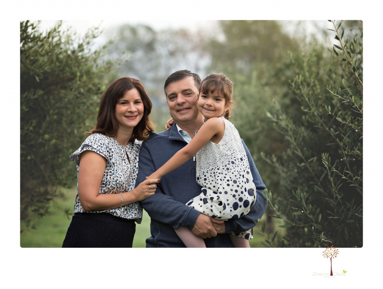 Sonora family portrait photographer Christine Dibble Photography takes Fall family portraits among the olive trees during a morning session at Hurst Ranch.