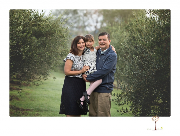 Sonora family portrait photographer Christine Dibble Photography takes Fall family portraits among the olive trees during a morning session at Hurst Ranch.