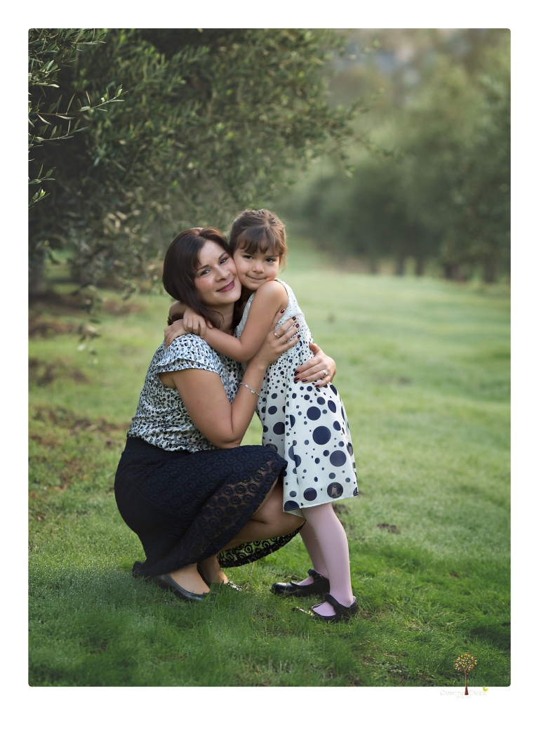 Sonora family portrait photographer Christine Dibble Photography takes Fall family portraits among the olive trees during a morning session at Hurst Ranch.