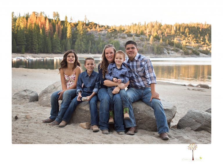 Sonora photographer Christine Dibble Photography takes family portraits at Pinecrest Lake in a golden lit field and on the beach.