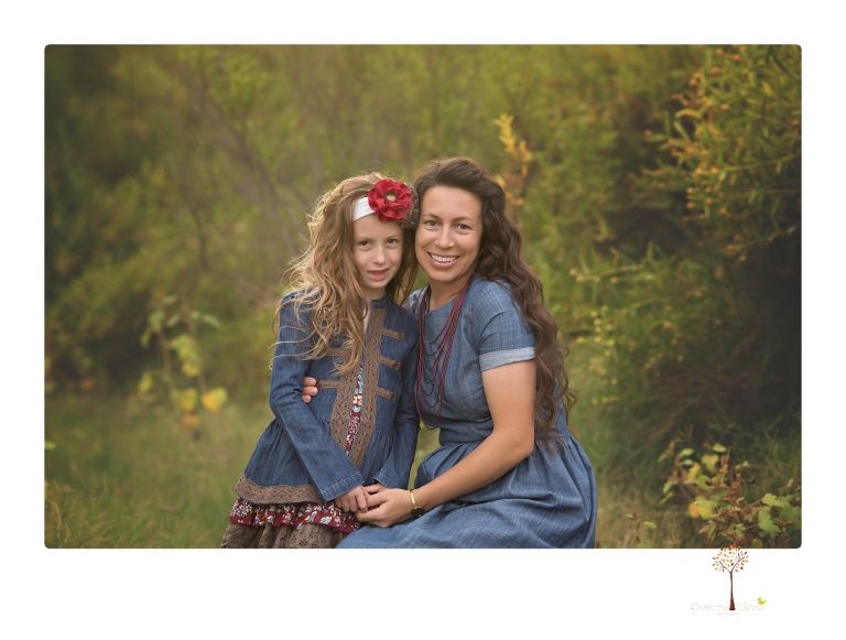 Sonora family photographer Christine Dibble Photography takes family portraits at Knights Ferry of a large family in perfectly coordinating outfits.