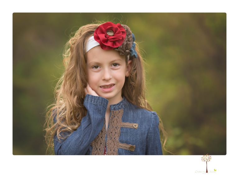 Sonora family photographer Christine Dibble Photography takes family portraits at Knights Ferry of a large family in perfectly coordinating outfits.