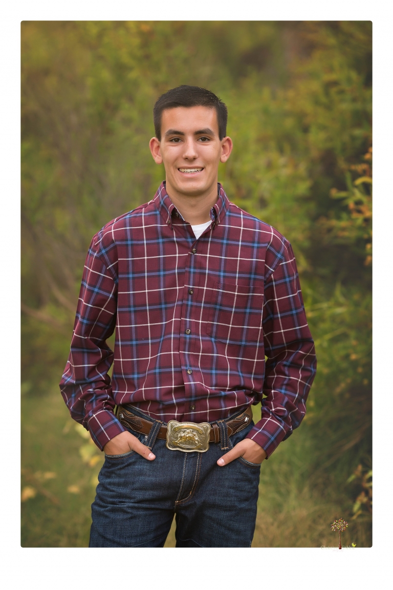 Sonora family photographer Christine Dibble Photography takes family portraits at Knights Ferry of a large family in perfectly coordinating outfits.