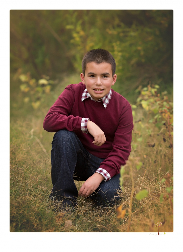 Sonora family photographer Christine Dibble Photography takes family portraits at Knights Ferry of a large family in perfectly coordinating outfits.