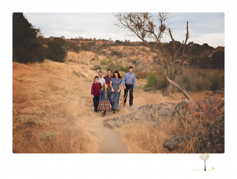 Sonora family photographer Christine Dibble Photography takes family portraits at Knights Ferry of a large family in perfectly coordinating outfits.