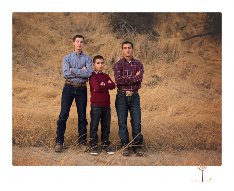 Sonora family photographer Christine Dibble Photography takes family portraits at Knights Ferry of a large family in perfectly coordinating outfits.