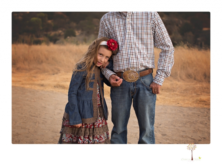 Sonora family photographer Christine Dibble Photography takes family portraits at Knights Ferry of a large family in perfectly coordinating outfits.
