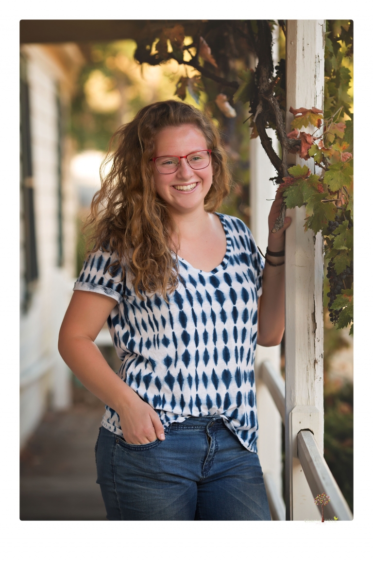 Sonora and Summerville High senior portrait photographer Christine Dibble Photography takes senior portraits of a Summerville High senior girl in Columbia State Historic Park with her moped and Edelweiss necklace.