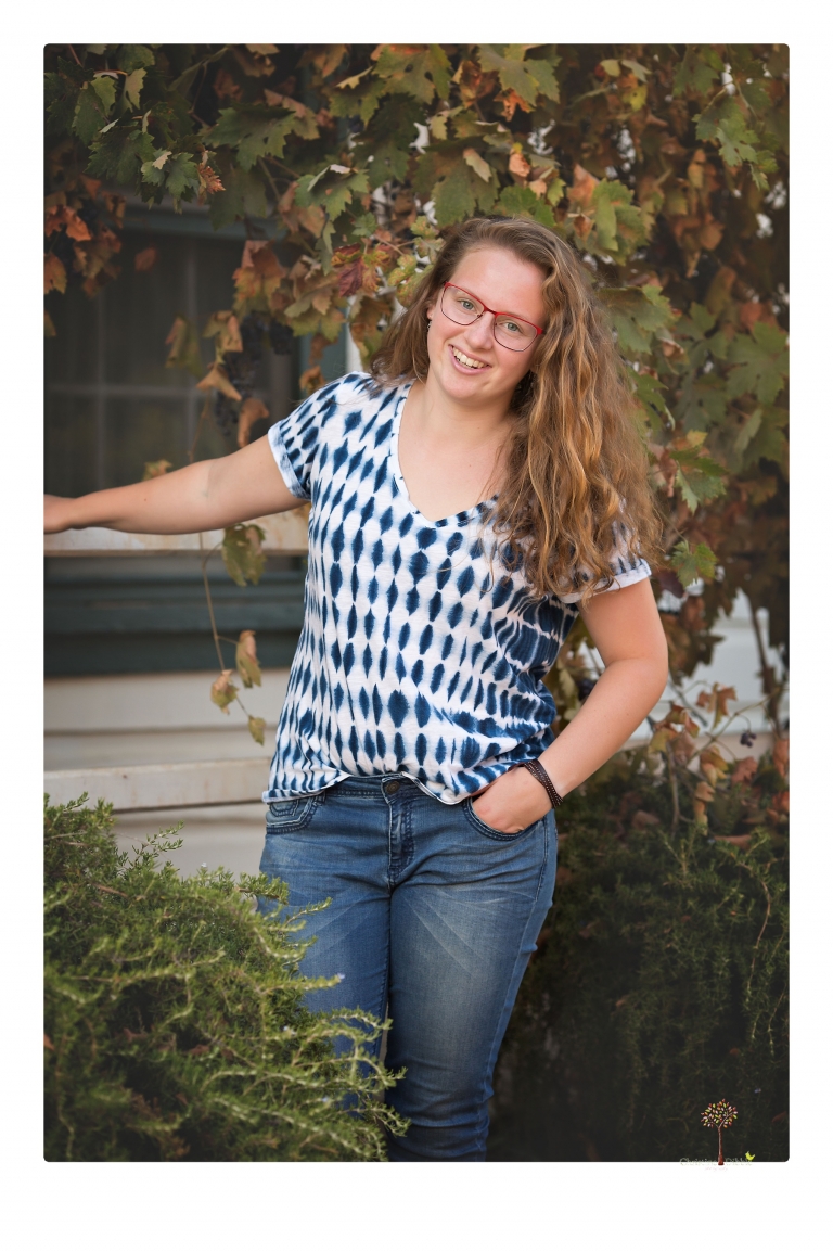 Sonora and Summerville High senior portrait photographer Christine Dibble Photography takes senior portraits of a Summerville High senior girl in Columbia State Historic Park with her moped and Edelweiss necklace.