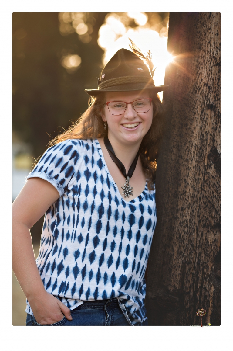 Sonora and Summerville High senior portrait photographer Christine Dibble Photography takes senior portraits of a Summerville High senior girl in Columbia State Historic Park with her moped and Edelweiss necklace.