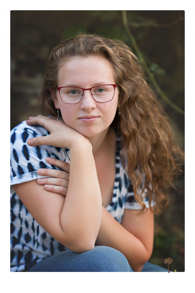 Sonora and Summerville High senior portrait photographer Christine Dibble Photography takes senior portraits of a Summerville High senior girl in Columbia State Historic Park with her moped and Edelweiss necklace.