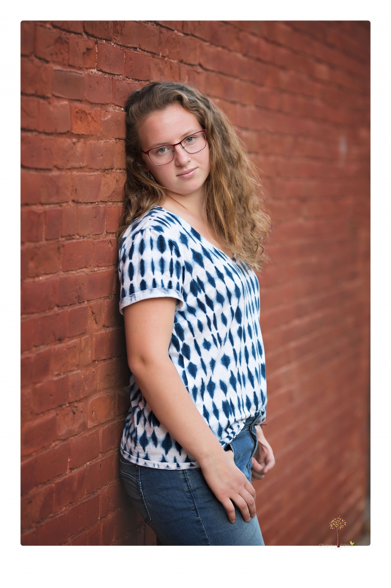 Sonora and Summerville High senior portrait photographer Christine Dibble Photography takes senior portraits of a Summerville High senior girl in Columbia State Historic Park with her moped and Edelweiss necklace.