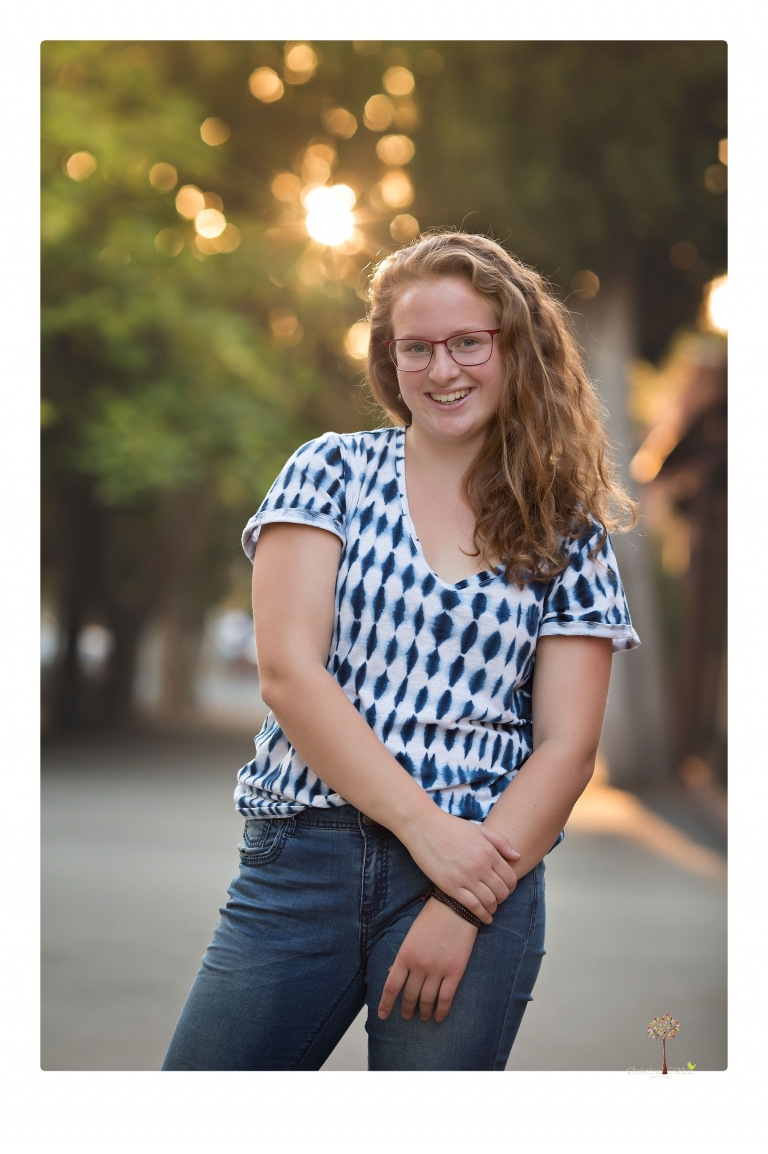 Sonora and Summerville High senior portrait photographer Christine Dibble Photography takes senior portraits of a Summerville High senior girl in Columbia State Historic Park with her moped and Edelweiss necklace.