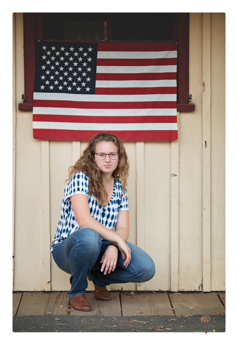 Sonora and Summerville High senior portrait photographer Christine Dibble Photography takes senior portraits of a Summerville High senior girl in Columbia State Historic Park with her moped and Edelweiss necklace.