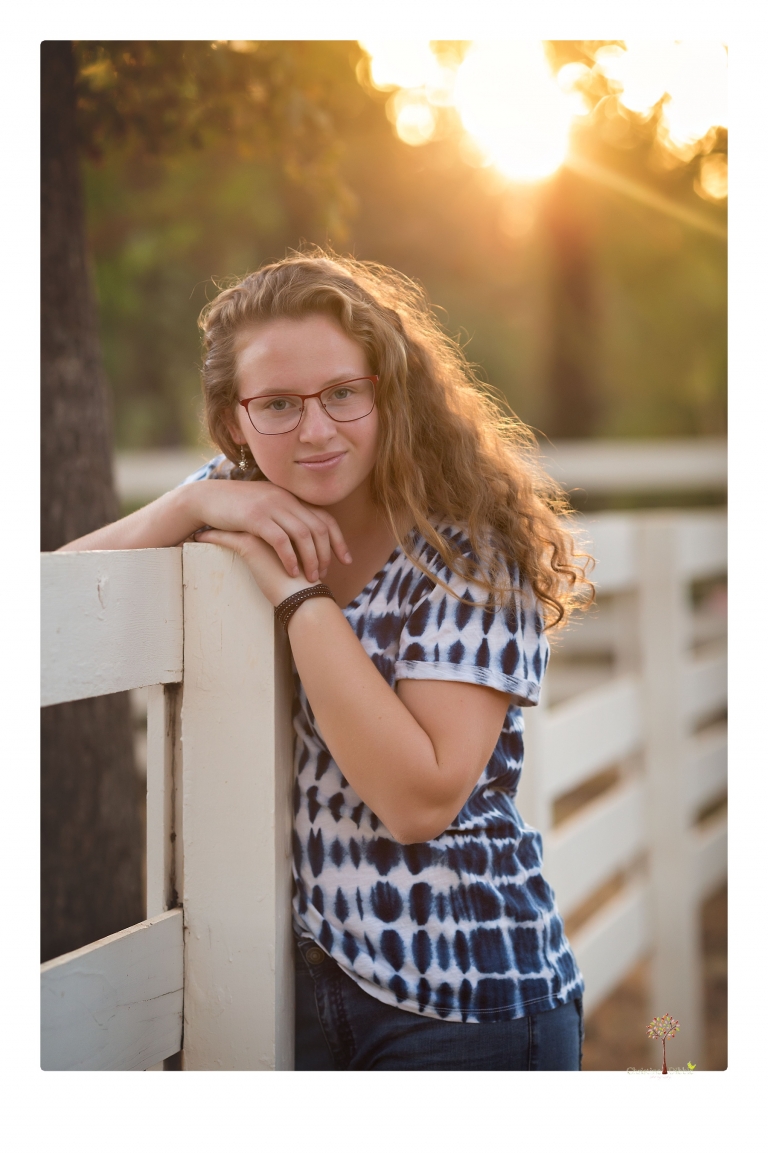 Sonora and Summerville High senior portrait photographer Christine Dibble Photography takes senior portraits of a Summerville High senior girl in Columbia State Historic Park with her moped and Edelweiss necklace.