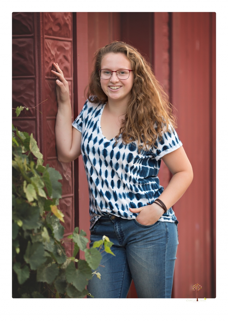 Sonora and Summerville High senior portrait photographer Christine Dibble Photography takes senior portraits of a Summerville High senior girl in Columbia State Historic Park with her moped and Edelweiss necklace.