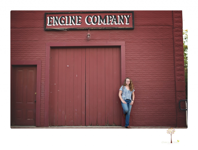 Sonora and Summerville High senior portrait photographer Christine Dibble Photography takes senior portraits of a Summerville High senior girl in Columbia State Historic Park with her moped and Edelweiss necklace.
