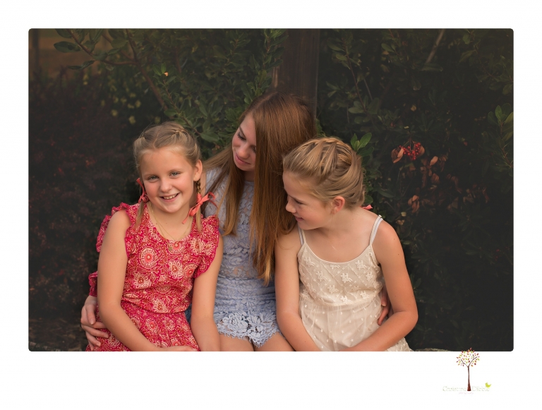 Sonora family photographer Christine Dibble Photography takes family portraits of a blended family in the backyard of their Tuolumne vacation home.