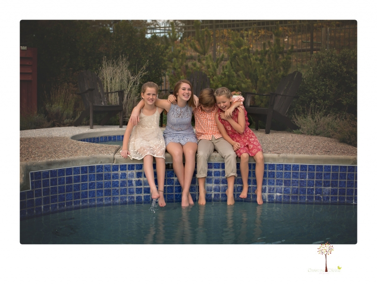 Sonora family photographer Christine Dibble Photography takes family portraits of a blended family in the backyard of their Tuolumne vacation home.