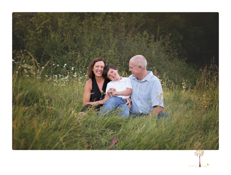 Sonora family photographer Christine Dibble Photography takes sunset family portraits in a field at Lake Tahoe in the summer.
