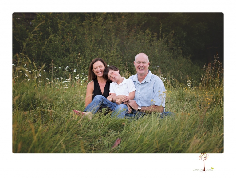 Sonora family photographer Christine Dibble Photography takes sunset family portraits in a field at Lake Tahoe in the summer.