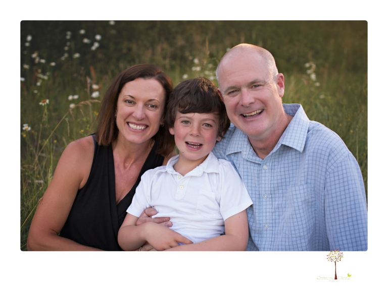 Sonora family photographer Christine Dibble Photography takes sunset family portraits in a field at Lake Tahoe in the summer.
