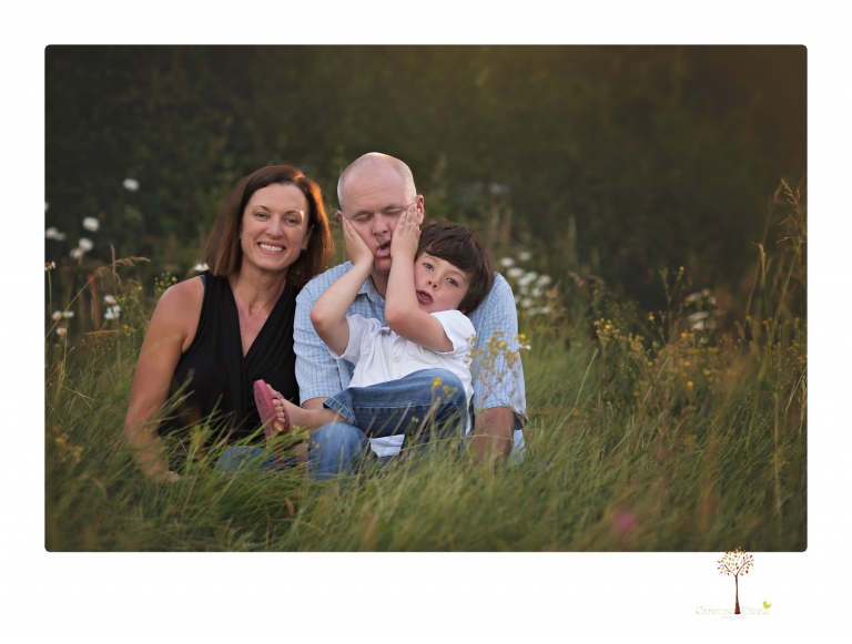 Sonora family photographer Christine Dibble Photography takes sunset family portraits in a field at Lake Tahoe in the summer.